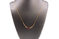 14kt Yellow Gold White Topaz and Ruby Fashion Necklace.